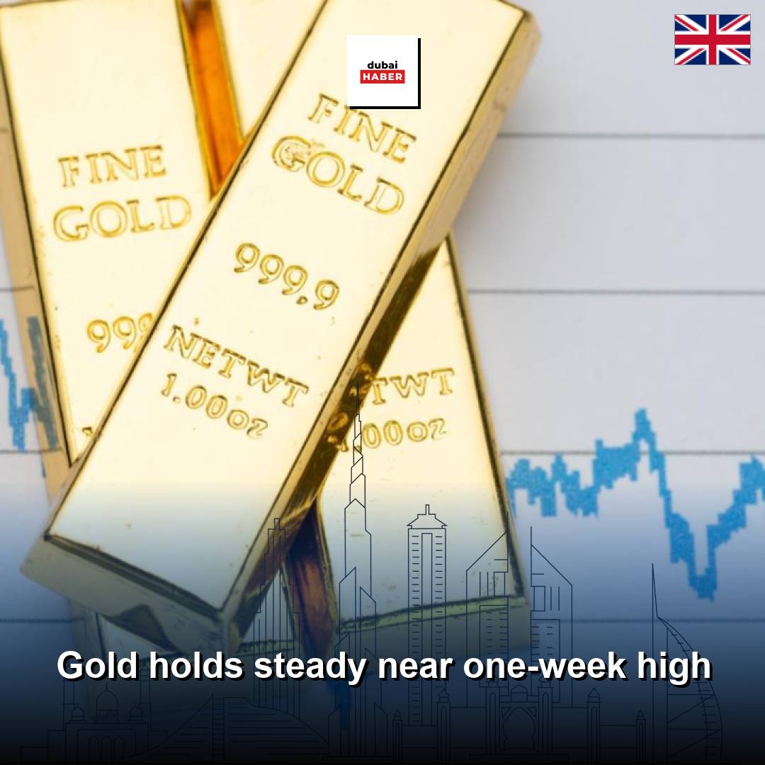 Gold holds steady near one-week high